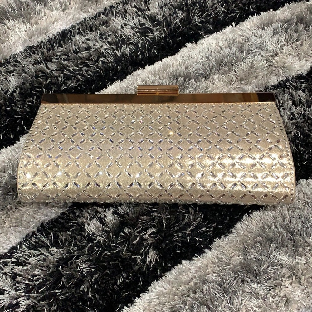 Gold clutch with tag